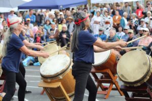 drummers at an Obon Festival perform for a large crowd