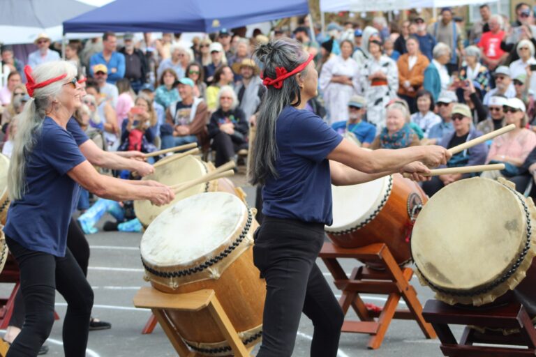 drummers at an Obon Festival perform for a large crowd