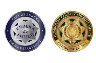 Blue and silver round badge for eureka police department on the left, gold and green round badge for Humboldt County sheriffs office on the right.